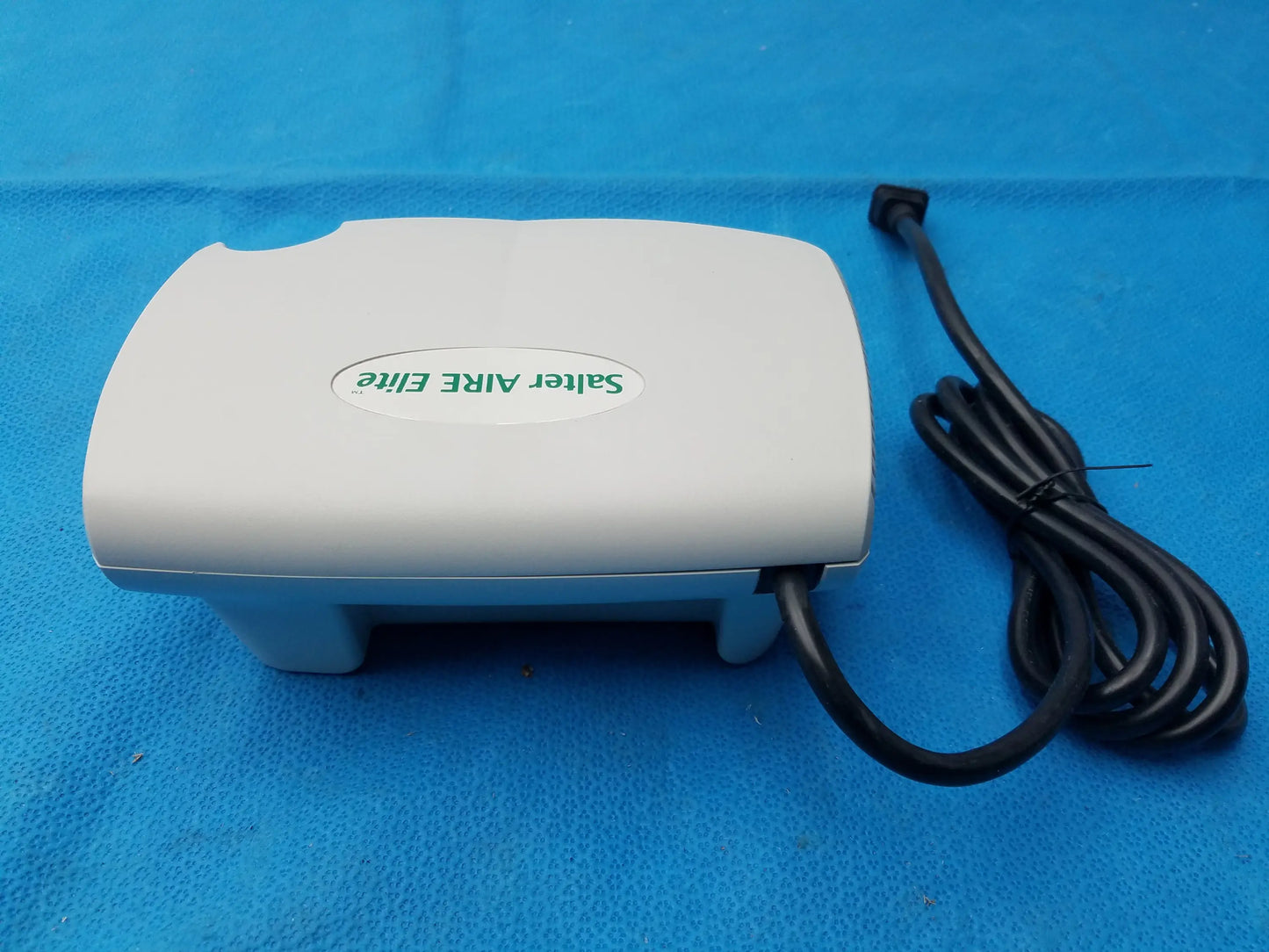 White plastic salter labs aire elite compressor nebulizer with black power cord for respiratory therapy use