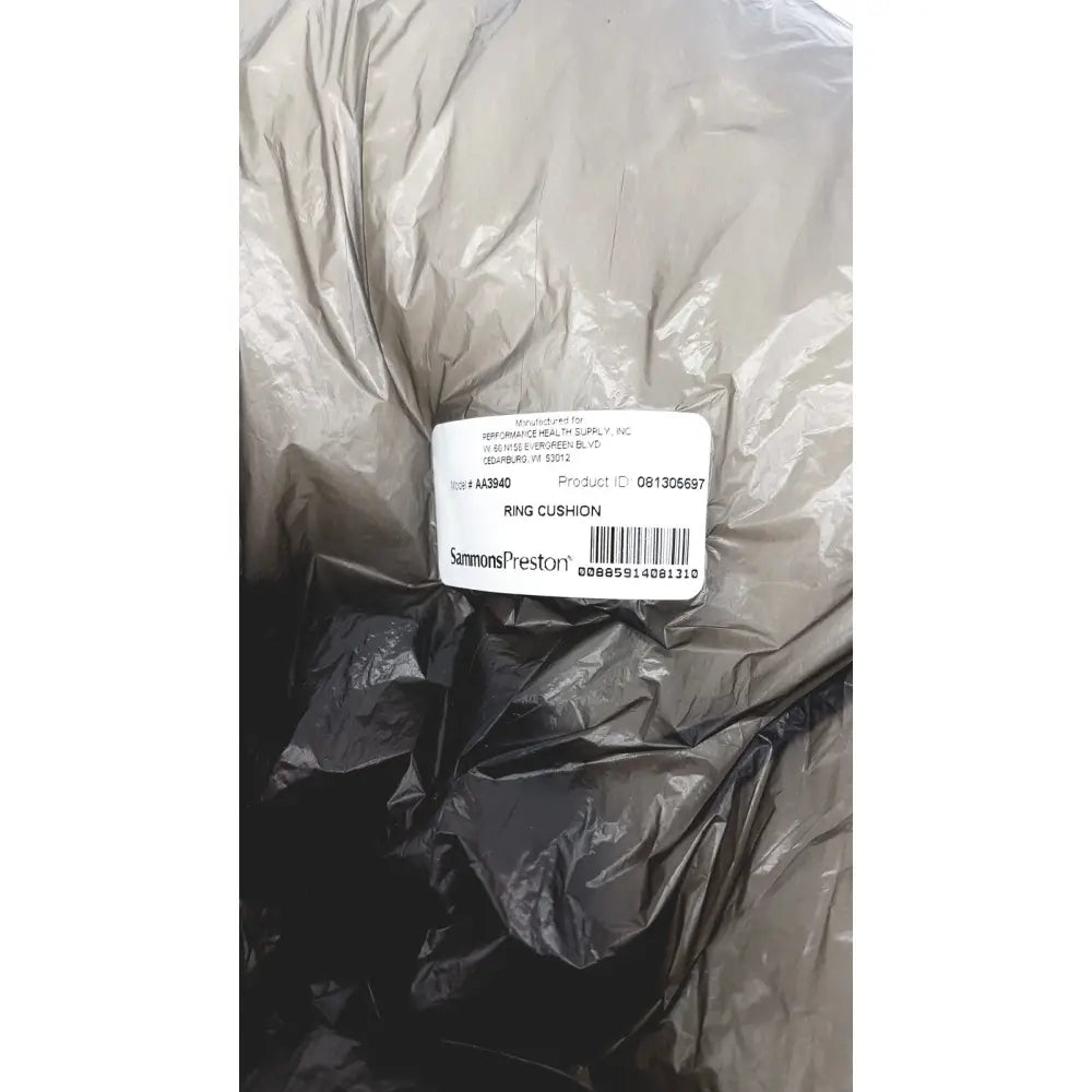A gray crinkled plastic bag containing a white sammons preston aa3940 ring cushion soft and comfortable for rings
