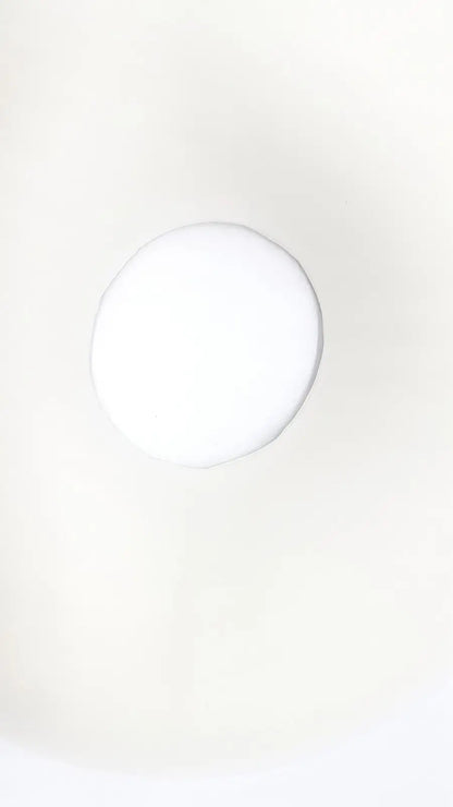 A smooth round white ceramic coaster featured in sammons preston aa3940 ring cushion for soft comfortable use
