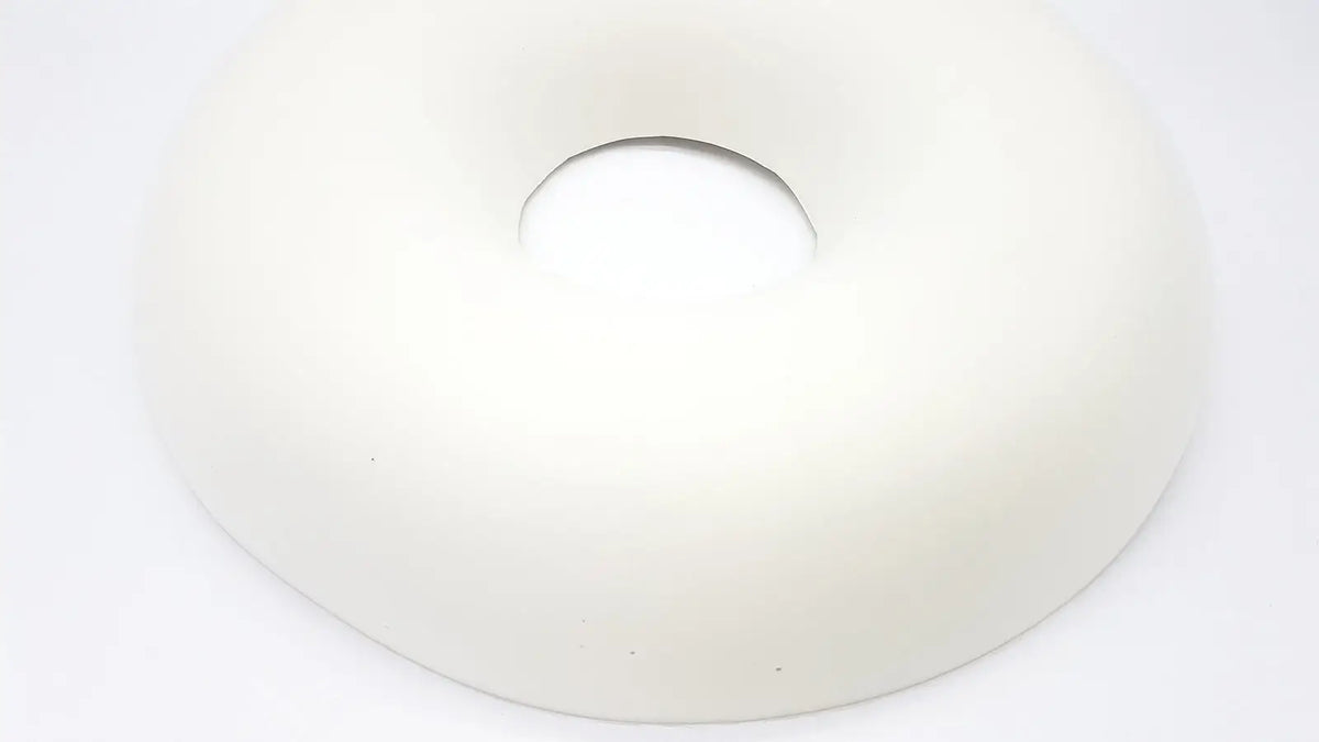 White donut-shaped plush cushion featuring sammons preston aa3940 ring design for soft comfortable support