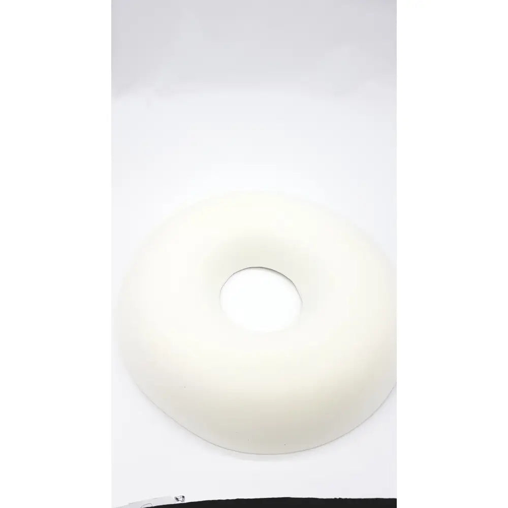 A smooth off-white sammons preston aa3940 ring cushion with soft rounded texture for comfort and support