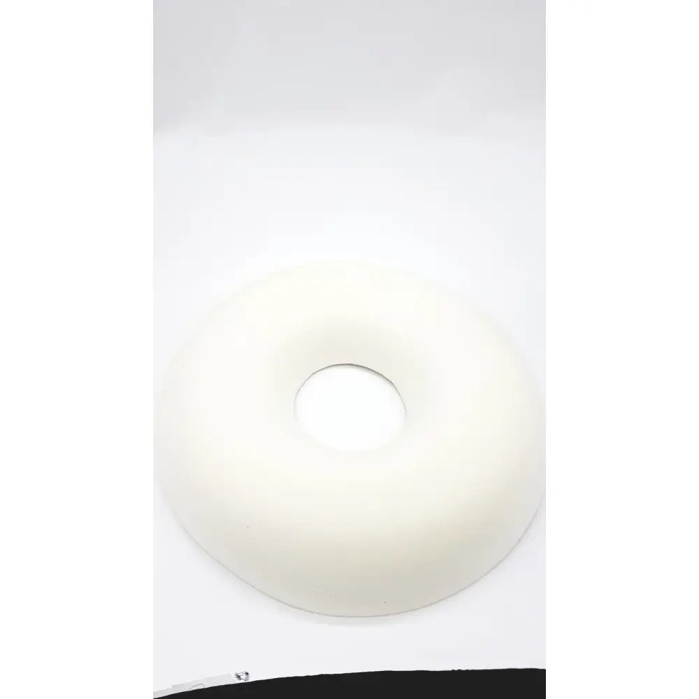 A smooth off-white sammons preston aa3940 ring cushion with soft rounded texture for comfortable seating