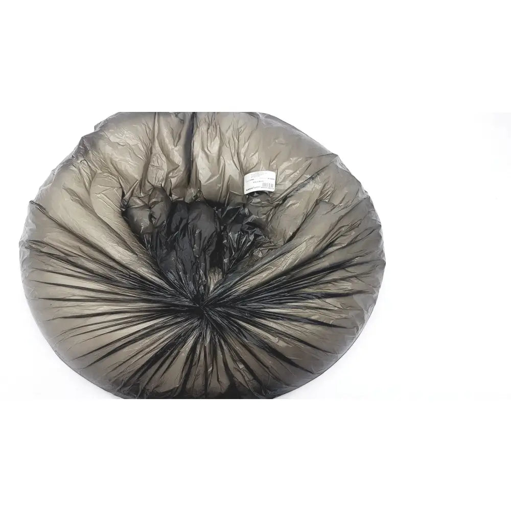 A crumpled black plastic bag on a white surface next to the sammons preston aa3940 ring cushion white