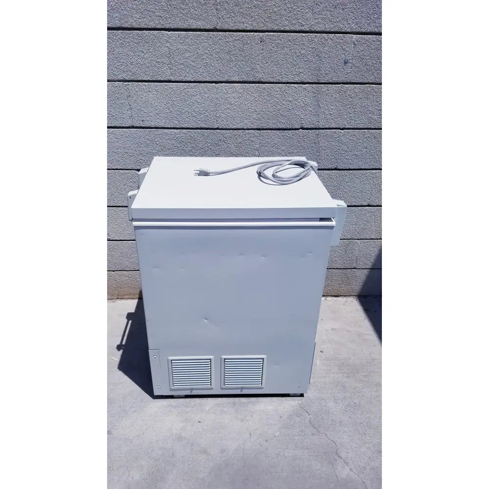 White rectangular chest freezer with coiled power cord on top sanyo vip series ultra low temperature freezer model mdf-c8v1