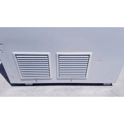 Gray industrial ventilation grilles with horizontal slats on metallic back side of sanyo vip series ultra low temperature freezer
