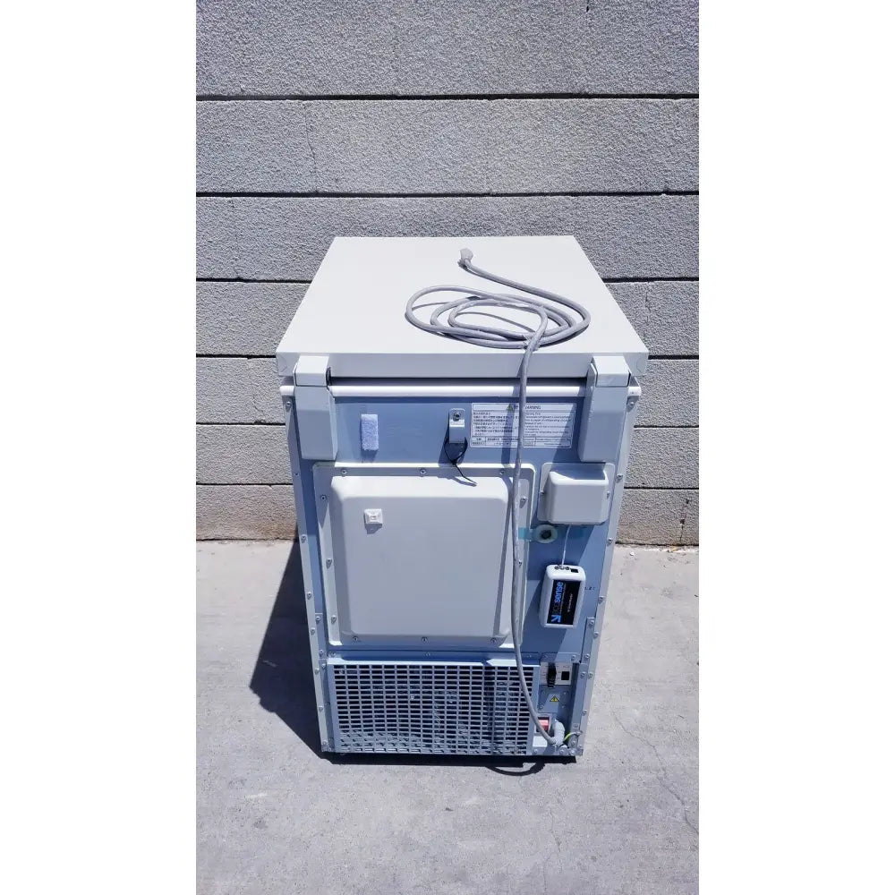 White and gray sanyo vip series ultra low temperature freezer model mdf-c8v1 with coiled power cord on top