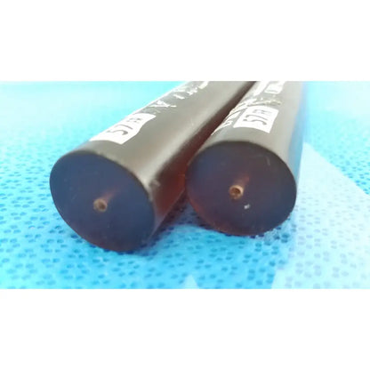 Two black savary gilliard dilator cook cylindrical endoscope 19mm 57fr with white labels and small holes at ends