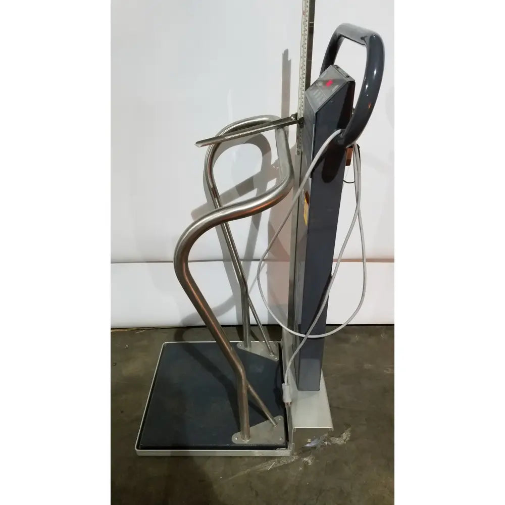 Silver metallic Scale-Tronix patient medical portable digital scale with curved handlebars and digital display unit