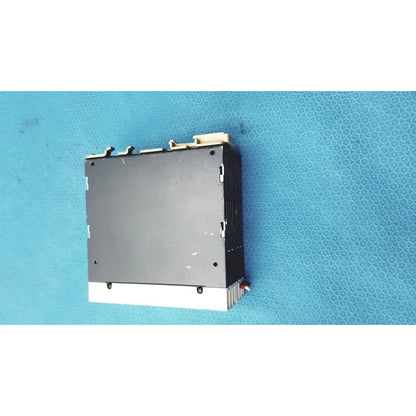 Black and white schneider electric abl7 rp1205 switch mode power supply with ribbed heat sink for din rail mounting