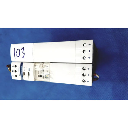 White rectangular schneider electric abl7 rp1205 switch mode power supply with labeled terminals and indicator lights