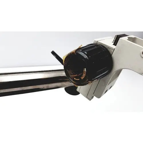 Black textured knob with gold lettering on white Scienscope ssz stereo zoom binocular microscope device