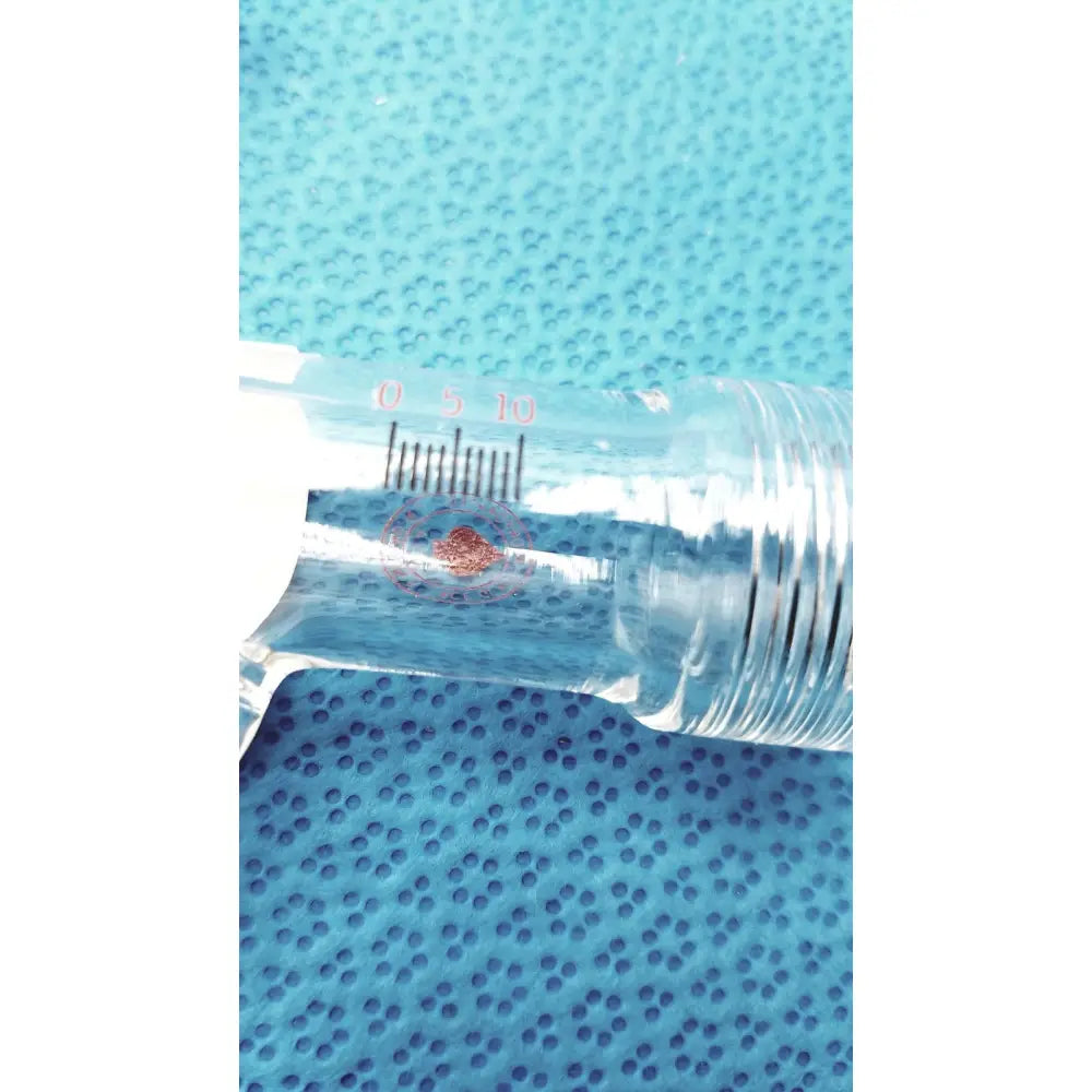 Clear glass syringe with red markings and white plunger made of borosilicate lab glass scientific glass apparatus for laboratory use