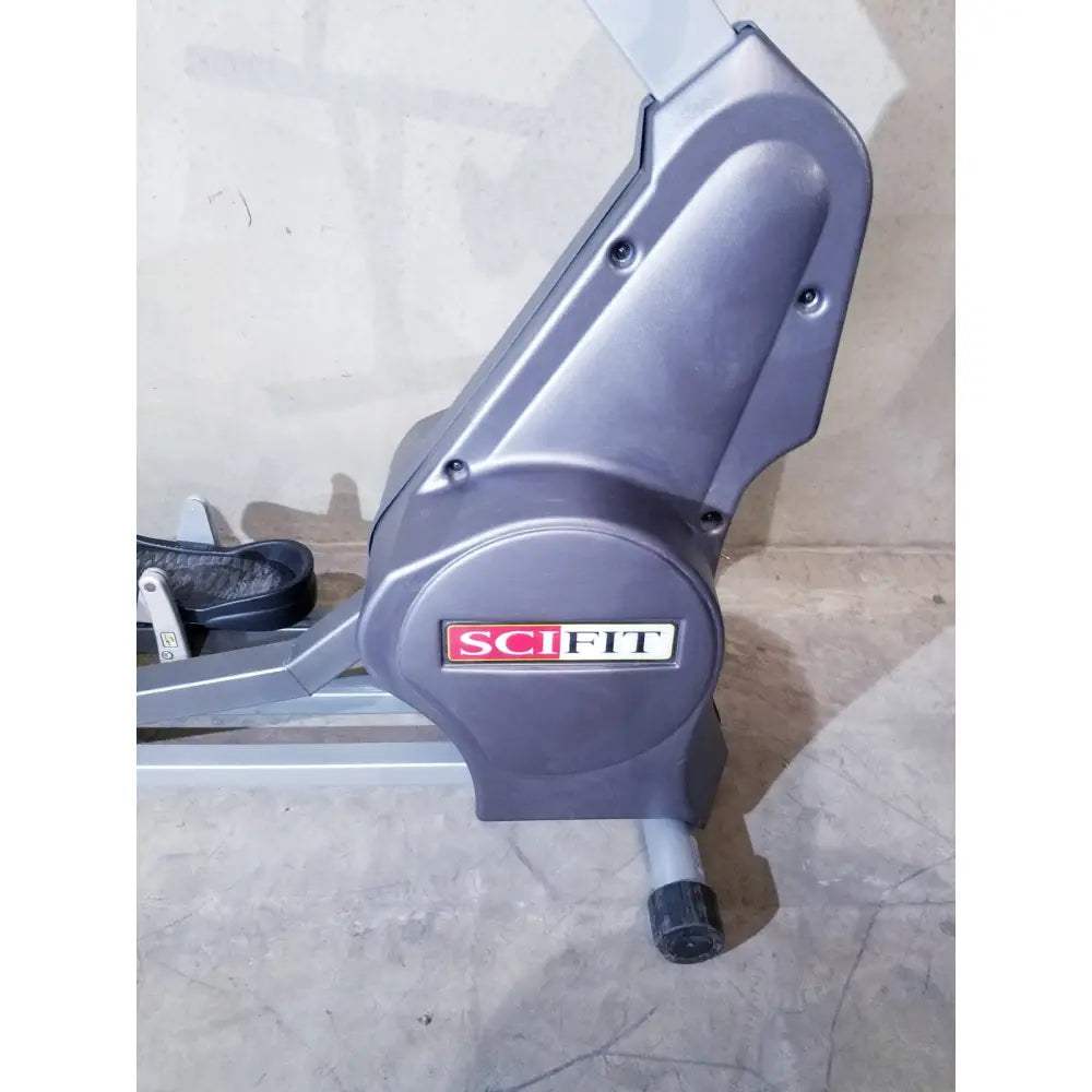 Gray plastic and metal scifit sx7000 elliptical commercial lower body trainer with red and white logo on front panel