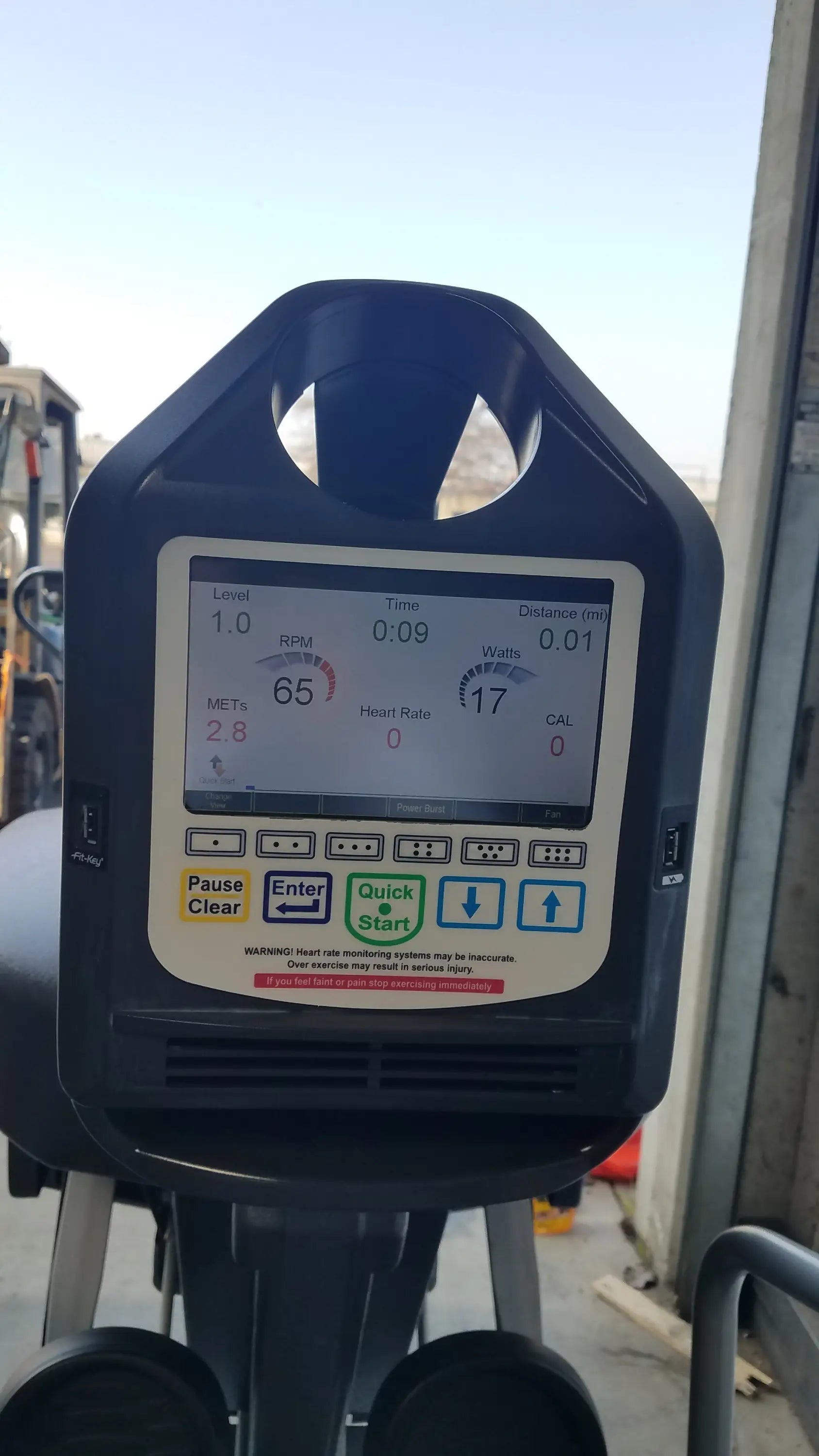 Black exercise bike console with digital display showing rpm distance and calories on scifit systems rst7000 recumbent stepper
