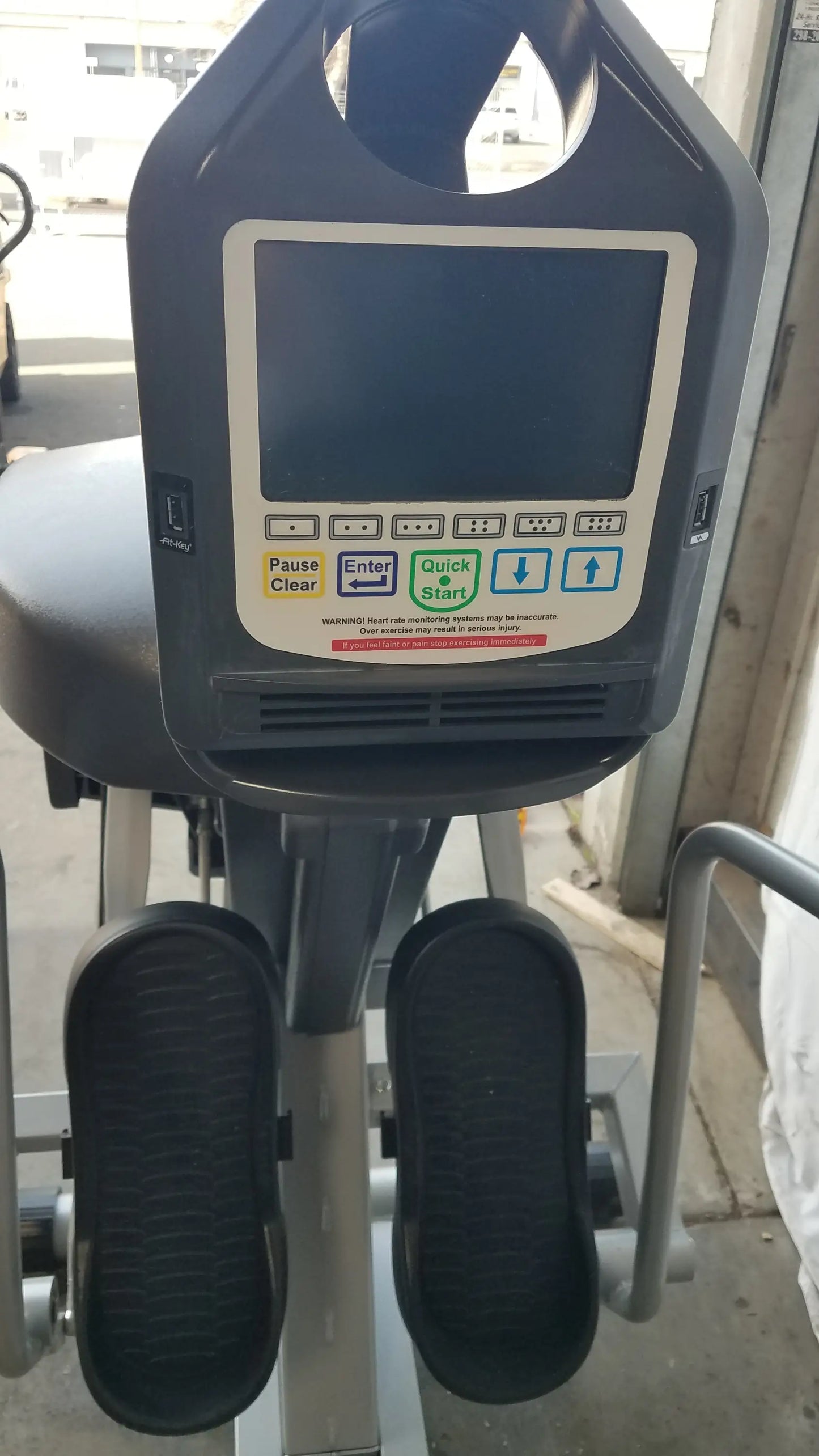 Gray scifit systems rst7000 recumbent stepper with digital display panel and black foot pedals for low-impact exercise