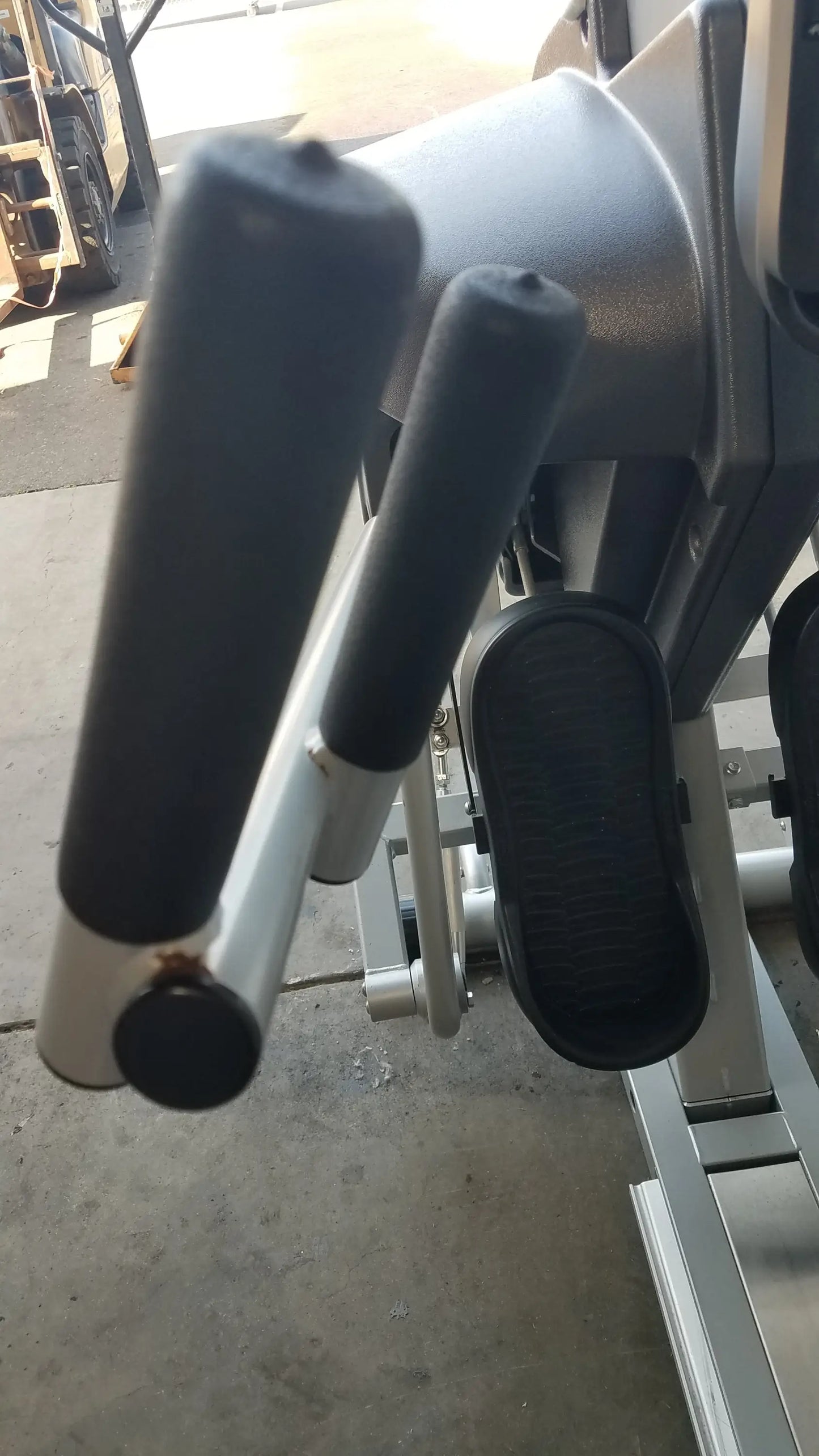 Gray and black textured exercise machine handles on the scifit systems rst7000 recumbent stepper s n 150-009060