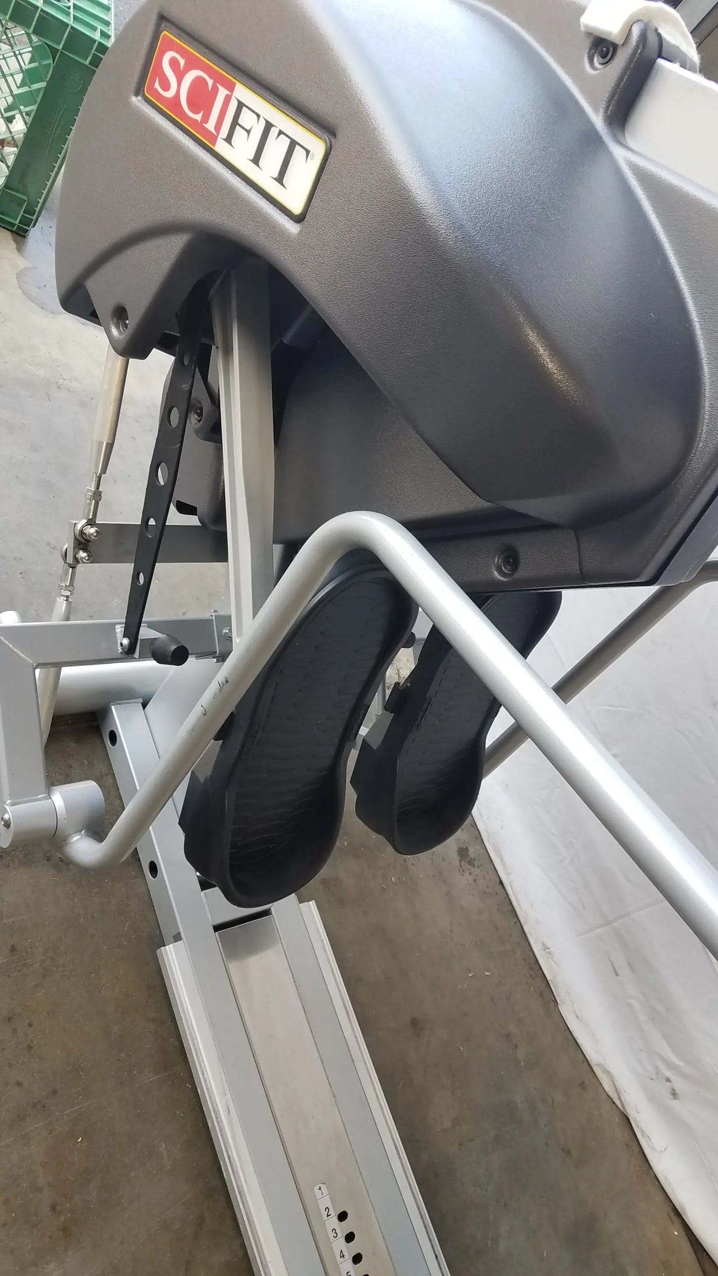 Gray scifit systems rst7000 recumbent stepper with black foot pedals and metallic silver frame for low impact exercise
