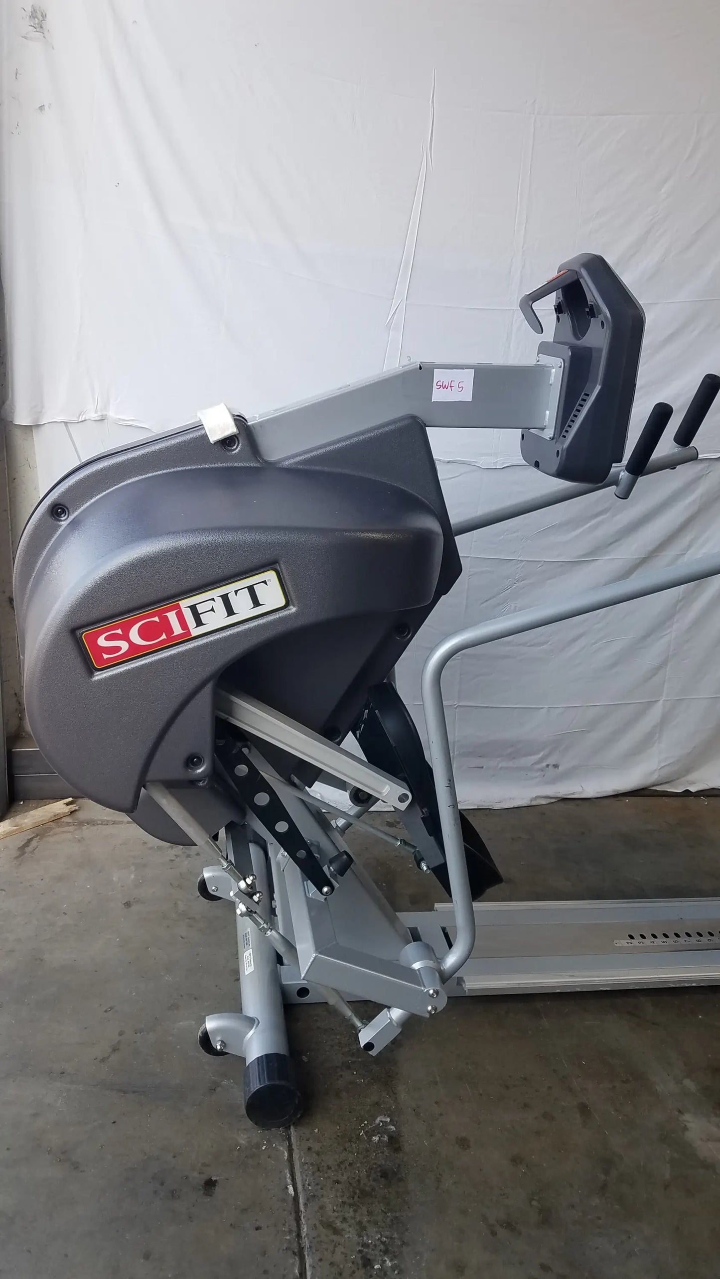 Gray scifit systems rst7000 recumbent stepper with metallic frame and black handle grips for low-impact exercise