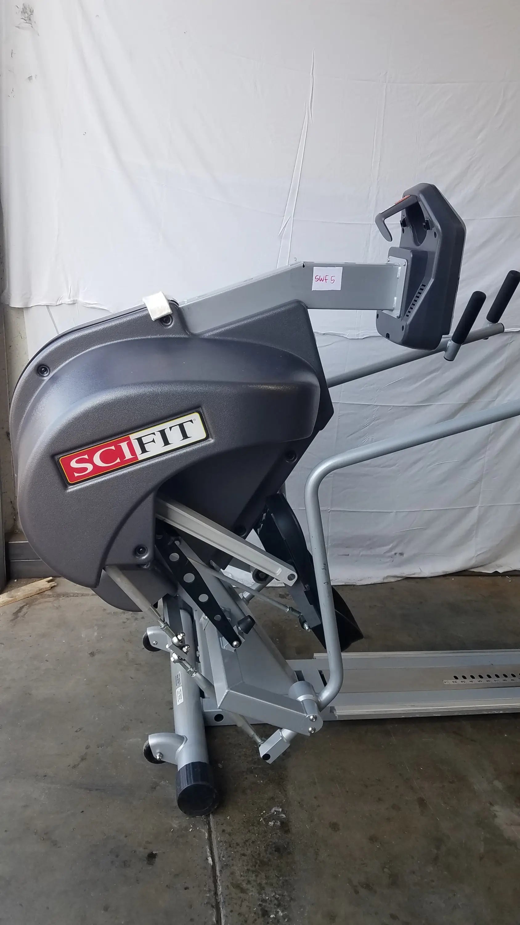 Gray scifit systems rst7000 recumbent stepper with metallic frame and black handle grips for low-impact exercise