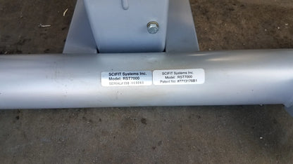 Silver cylindrical metal pipe with white labels on scifit systems rst7000 recumbent stepper sn 150-009060