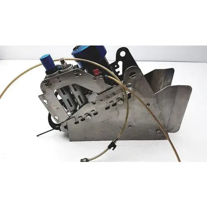 Industrial-grade pneumatic fish stunner with blue hydraulic fittings and exposed metal components by Seafood Innovations