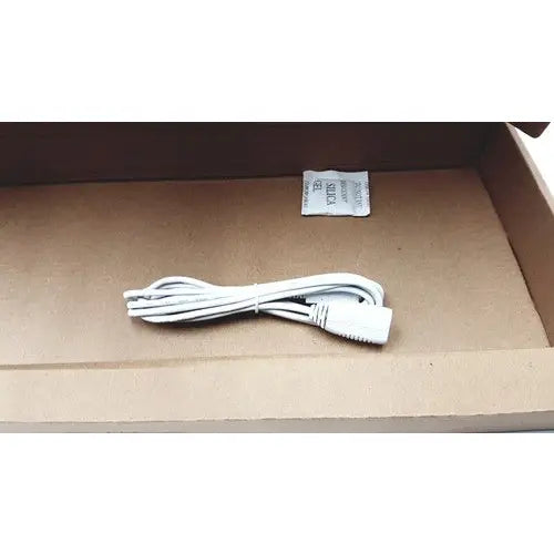 White power cord with plastic connector neatly coiled for seal shield cleanwipe medical grade keyboard use