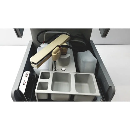 Beige robotic arm with articulated joints and cables mounted inside gray housing of sebia hydraplus 2 autosampler for chromatography systems