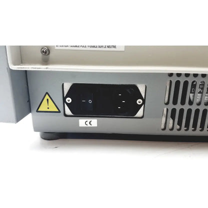 Gray metal power input panel with black switch and warning label on back of sebia hydraplus 2 autosampler for reuse medical chromatography systems