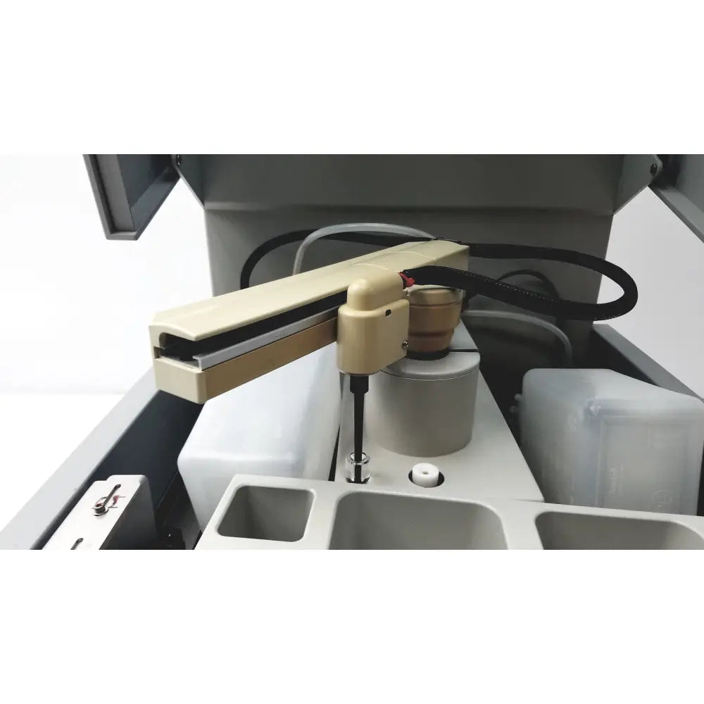 Beige robotic arm with black cable and metallic joint mounted on gray sebia hydraplus 2 autosampler for chromatography systems