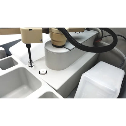 Beige robotic arm with black hose and metallic end effector on white industrial sebia hydraplus 2 autosampler for reuse medical chromatography systems
