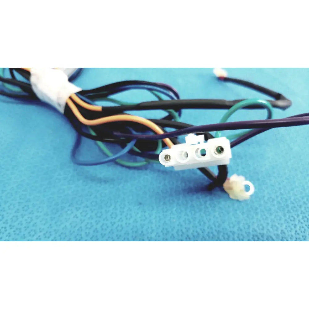 White plastic seiwa ferrite cores connector with three terminals and black insulated connectors lead wire bundled nearby
