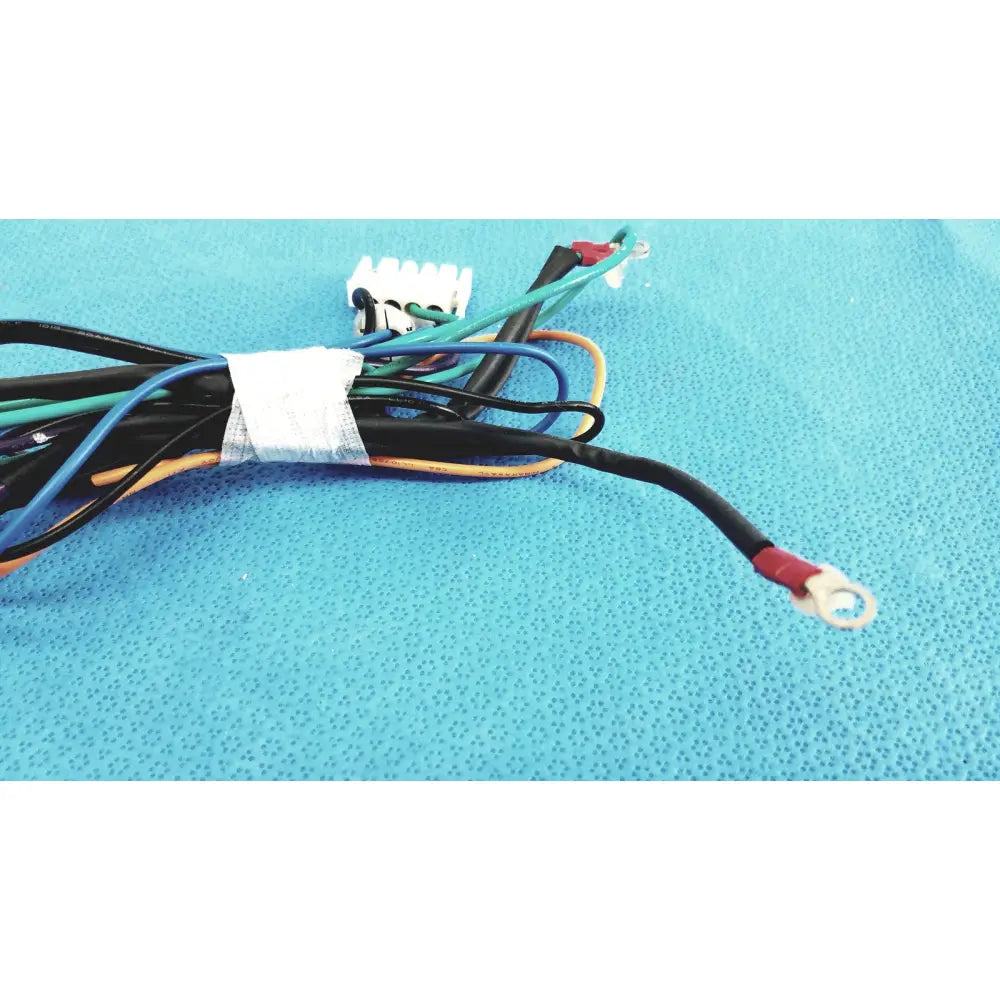 A bundle of multi-colored electrical wires with white connector and red terminals for seiwa ferrite cores connectors lead wire harness