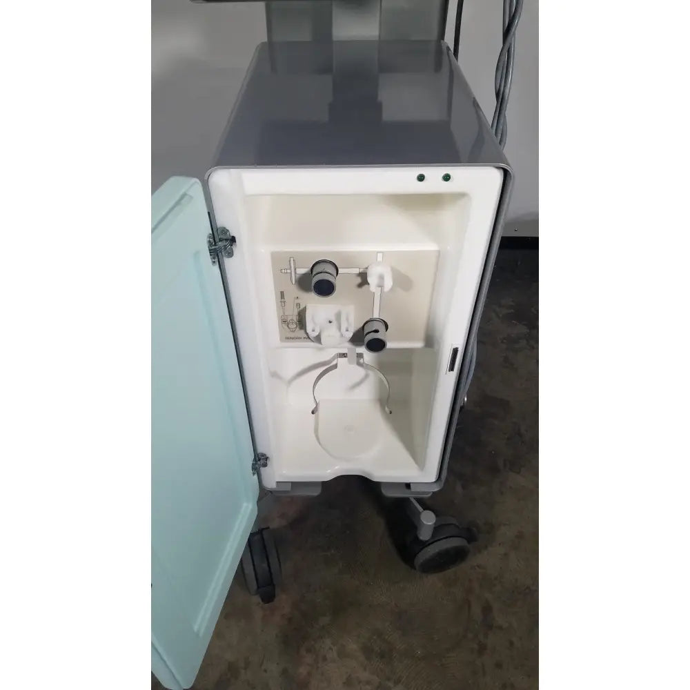 Gray medical imaging cart showing the back side of senorx cm3000 control module with white interior and tubing connectors