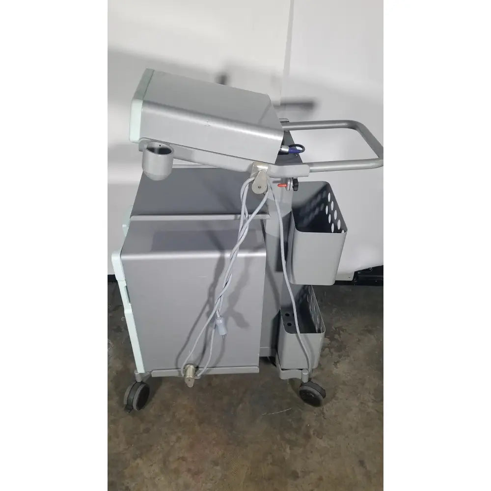 Gray medical cart with monitor and side baskets for senorx cm3000 control module encor breast biopsy vacuum system