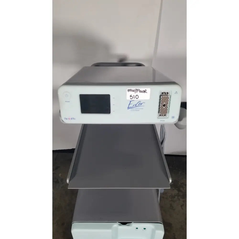 Silver-gray senorx cm3000 control module with small screen and labeled ports for encor breast biopsy system use