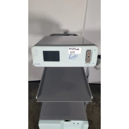 Silver-gray senorx cm3000 control module with small screen and labeled ports for encor breast biopsy system use