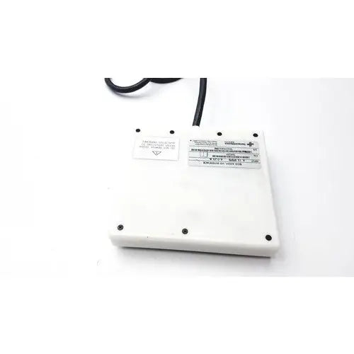 White rectangular power adapter with black cord and labels on the back of sensormedics 769259 interface box assembly