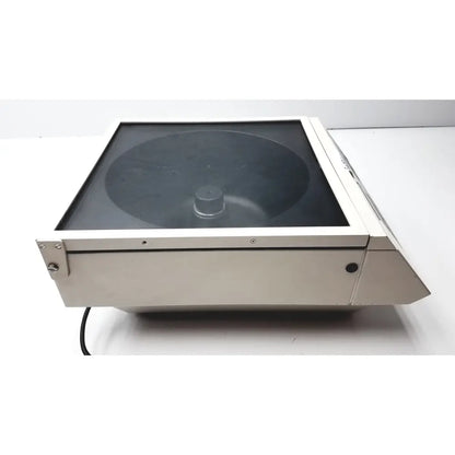 Silver-colored metal shandon cytospin 3 cytocentrifuge with transparent glass lid and circular rotor for reuse medical applications