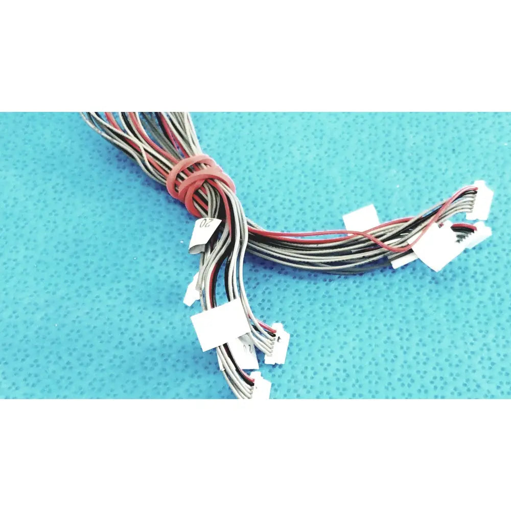 A bundle of multi-colored wires with white connectors and red tie for shinagawa awm 1007 female connectors wire harness