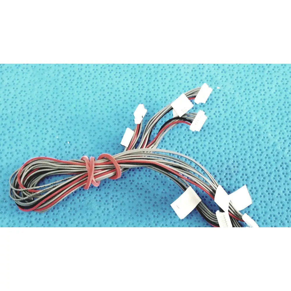 A bundle of multi-colored wires with white connectors tied by a red band in shinagawa awm 1007 connectors wire harness
