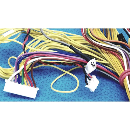 A bundle of colorful multi-stranded shinagawa awm 1007 female connectors wire harness with white plastic connectors and tag