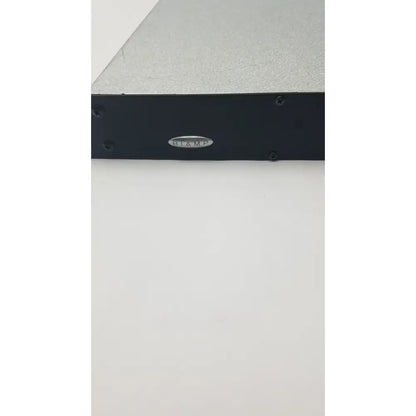 Black biaamp audio amplifier with silver textured top and four screws in shure scm800 rackmount professional mixer