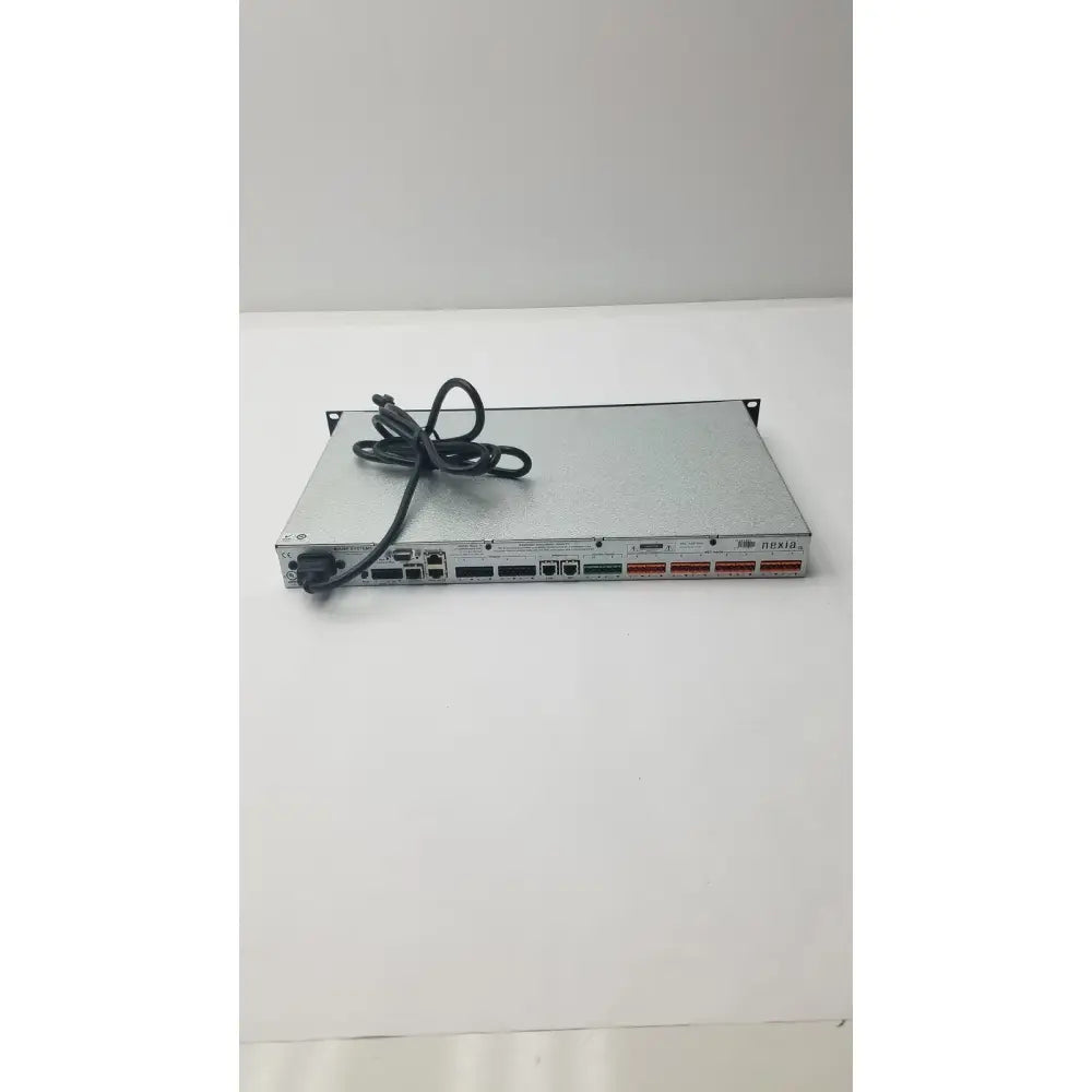 Silver metallic shure scm800 rackmount professional 8 channel microphone mixer with black power cord coiled on top