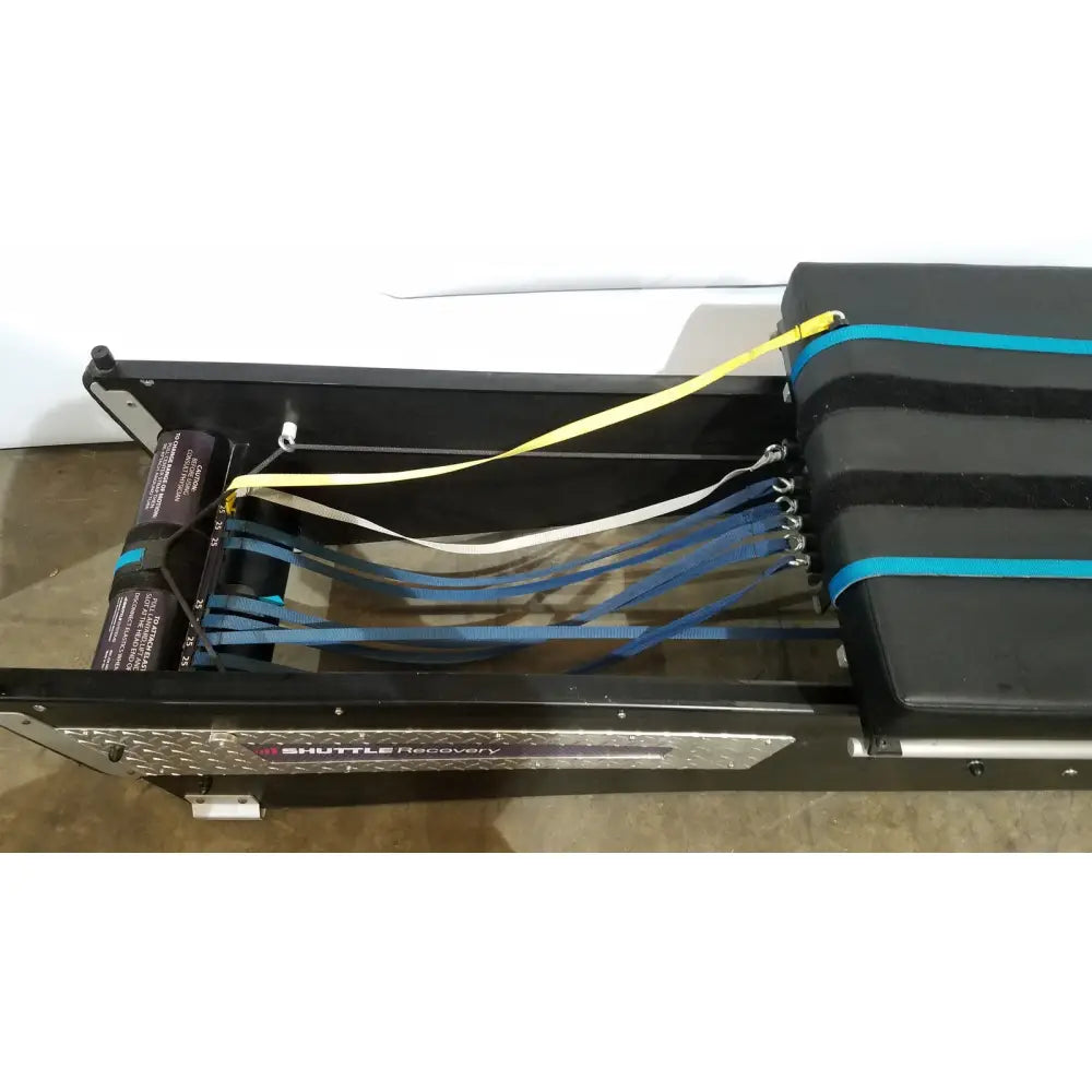 Black shuttle recovery sport trailer secured with blue and yellow straps for efficient shuttle recovery use