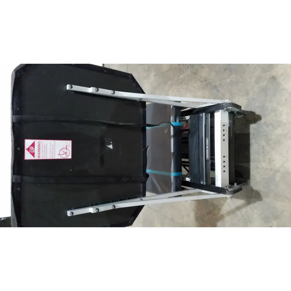 Black padded flight case with silver metal frame blue straps and warning label for shuttle recovery sport product