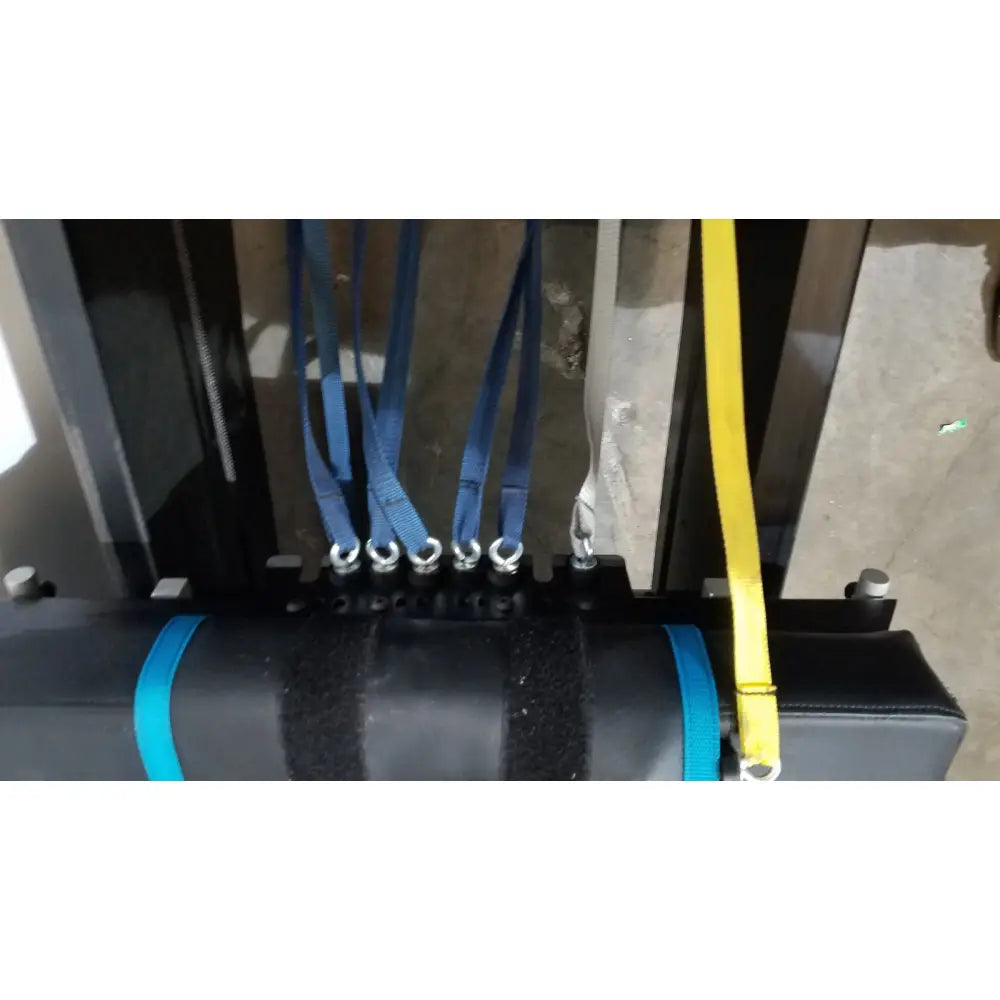 Black cylindrical shuttle recovery sport weight with blue straps and textured surface for enhanced grip and stability