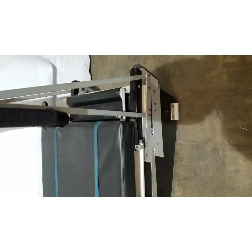 Gray and black weight bench with blue trim designed for shuttle recovery sport and recovery sport training use