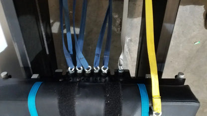 Black cylindrical shuttle recovery sport weight with blue straps and textured surface for enhanced grip and stability