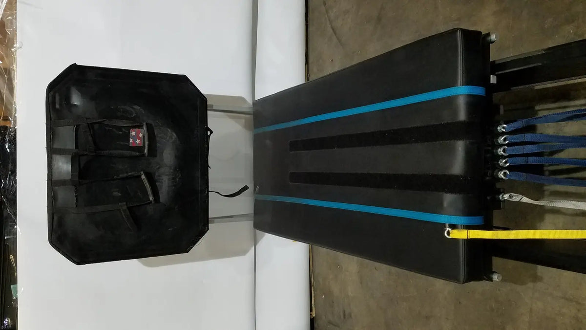 Black industrial-grade cargo carrier with blue accent stripes and multiple attachment points for shuttle recovery sport use