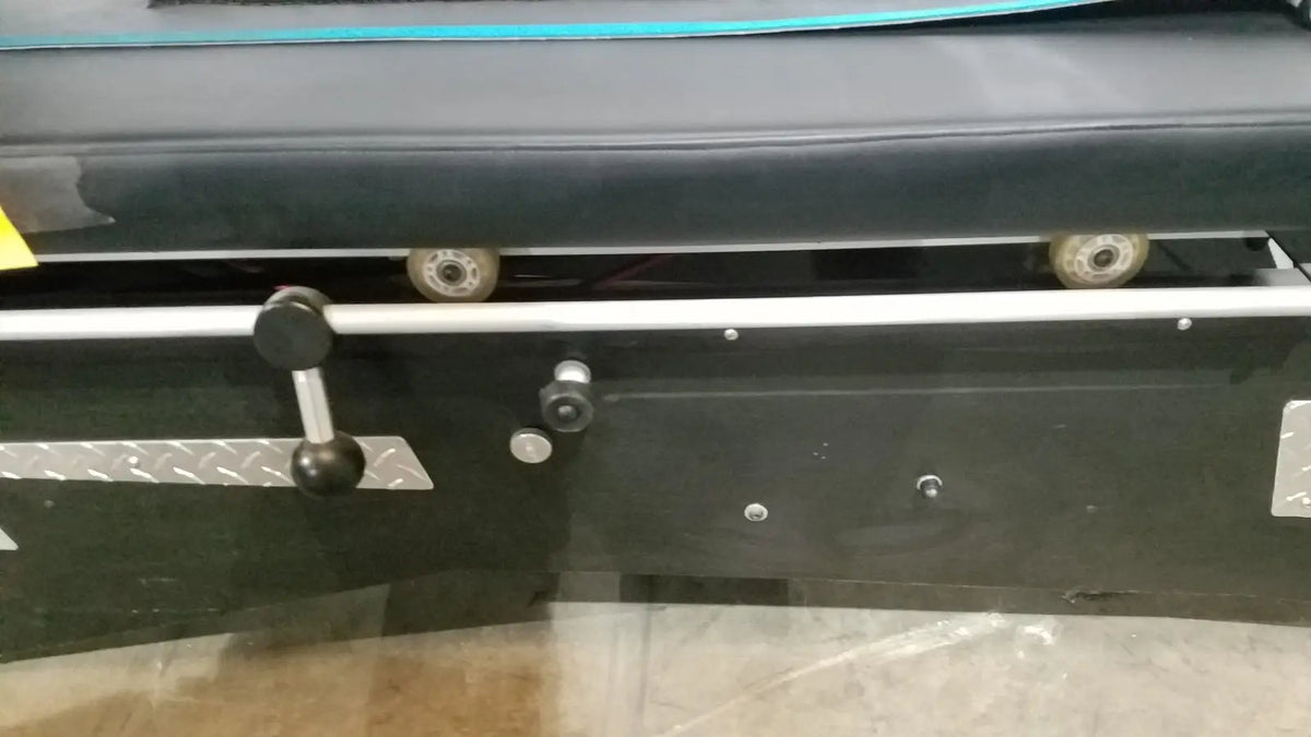 Black industrial shuttle recovery sport machine with silver metal handle and wheels for efficient recovery sport use